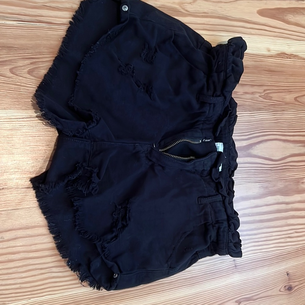 Black jean shorts with rips